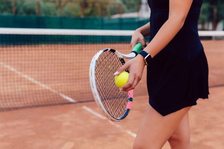 tennis-player-close-up-photo-of-athlete-woman-in-sportswear-holding-racket-and-ball (1)
